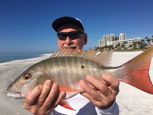 Â Steve Herich holds up his client&#39;s unusual inshore catch.