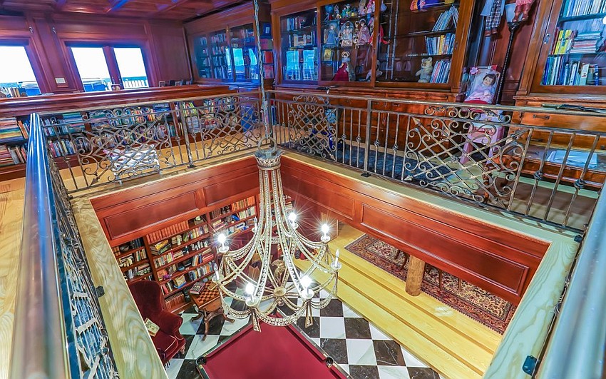 The second story houses the master bedroom and library.