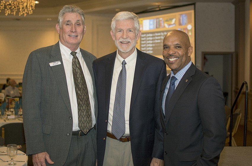 Jon Thaxton, Board Chairman Dennis McGillicuddy and Marlon Brown