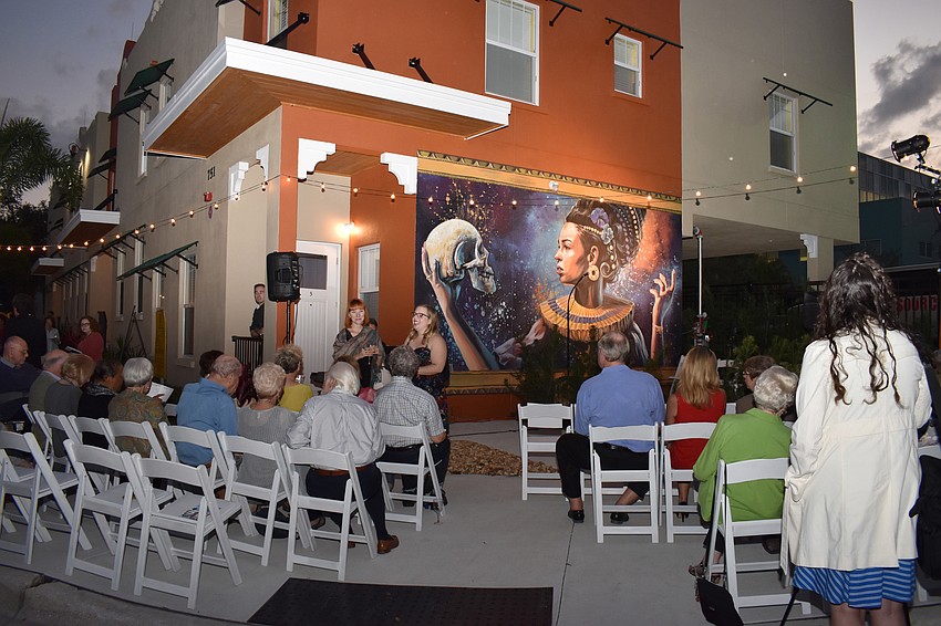 Guests gathered for a dedication ceremony after touring the residence.
