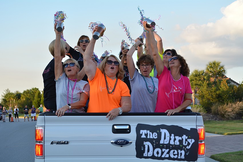 Lynda Solimine, Barbara Richards, Nancy Berks and Tracy Clark, front, are part of the Dirty Dozen float, which represents their martini club.