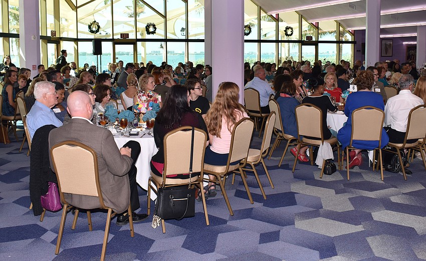 Guests listen to opening remarks.