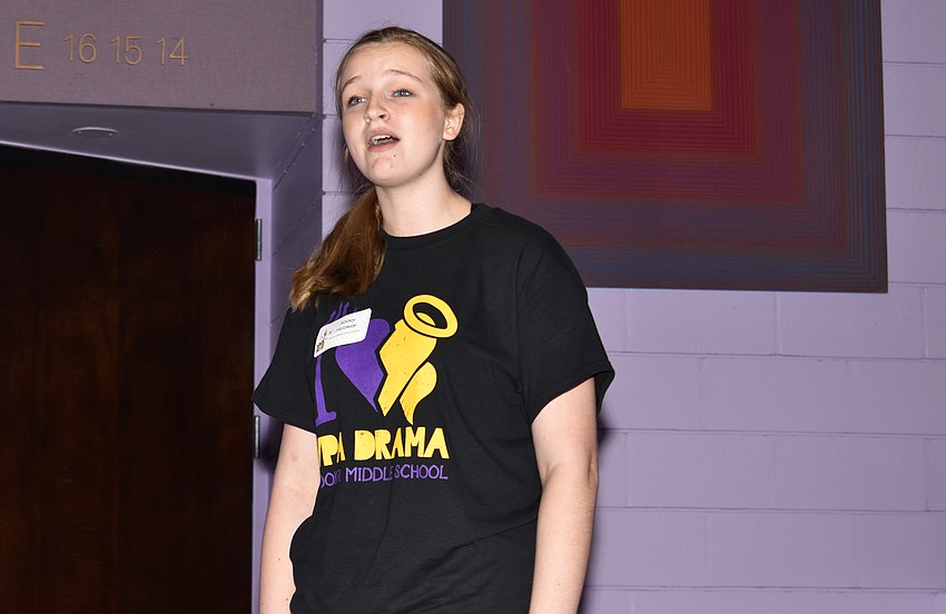 Abbey Holdway, a Booker Middle School VPA theater student, performs for guests in the lobby as they arrive.