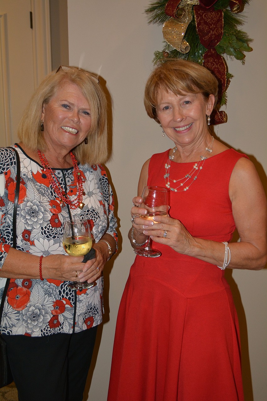 Julia Dennis, of Country Club West, and Diane Wagner, of Esplanade, catch up as the event starts.
