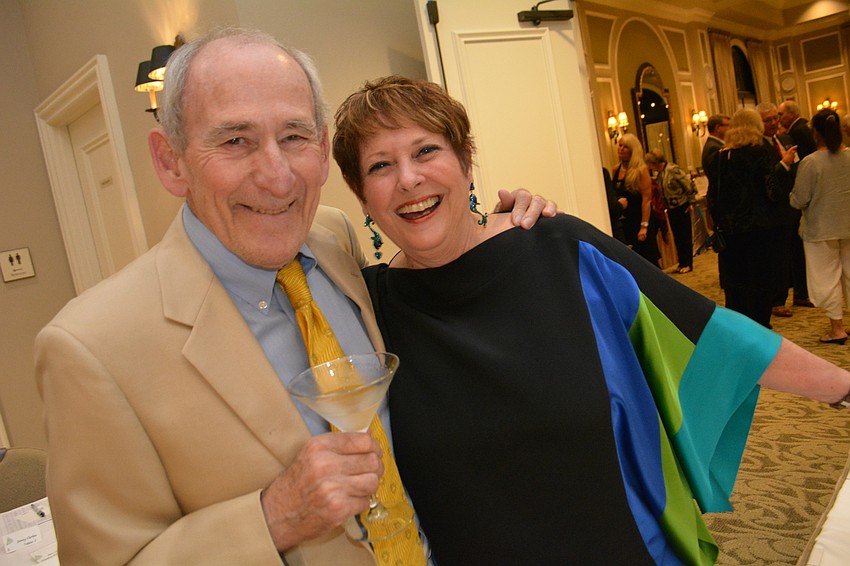 Bob and Trish Newman check in. Trish Newman was in charge of programming for the club this year.