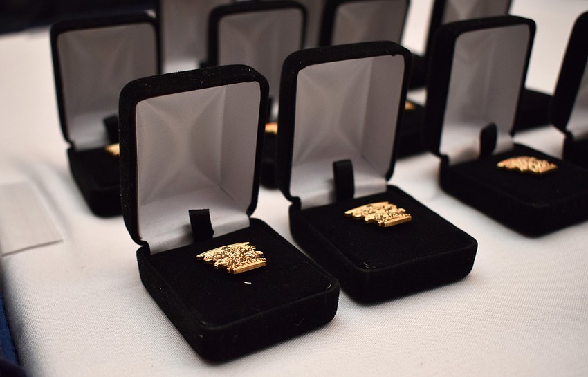 New members were all honored with a gold corinthian column pin.