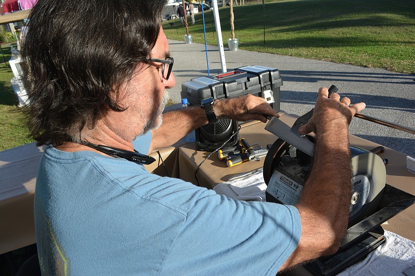 Van Balam of Van's Sharpening of Braden Woods shows off his skills.
