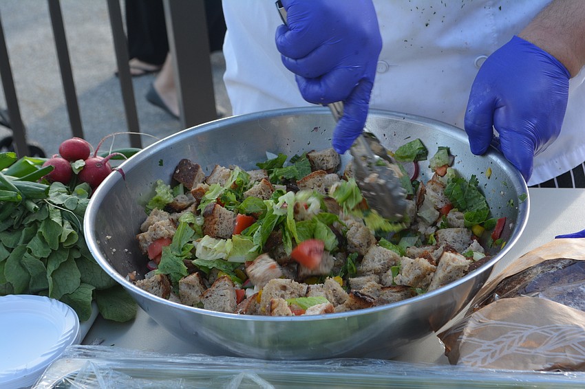A cooking display by Culinary Innovation Lab at USF offers Panzanella.