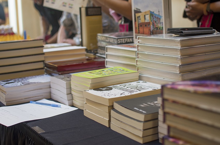Confrencegoers purchased speaker's books between lecture sessions.