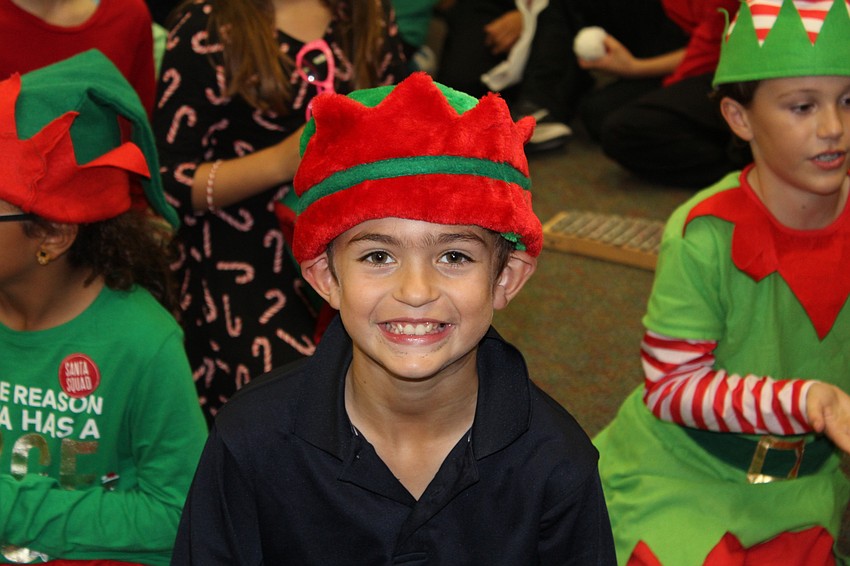 Willis Elementary School third-grader Mac Gilmore plays an elf for the holiday show.