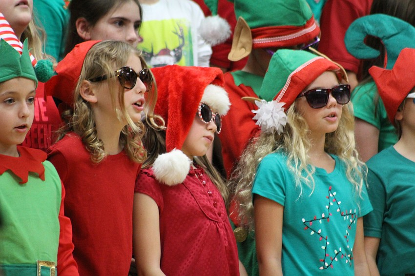 Willis Elementary School third-graders Katherine Facciolla, Meighan Traeger and Laney Rowe whip out their shades on stage.