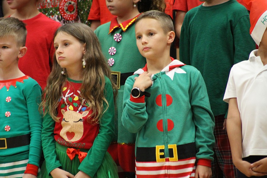 Willis Elementary School third-graders Nellie Morells and Nick Chop pout on stage as part of one of the Christmas songs.
