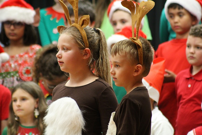Willis Elementary School third-graders Sadie Barbour and Porter Osuch played 'reindeer speakers' in this year's holiday extravaganza.