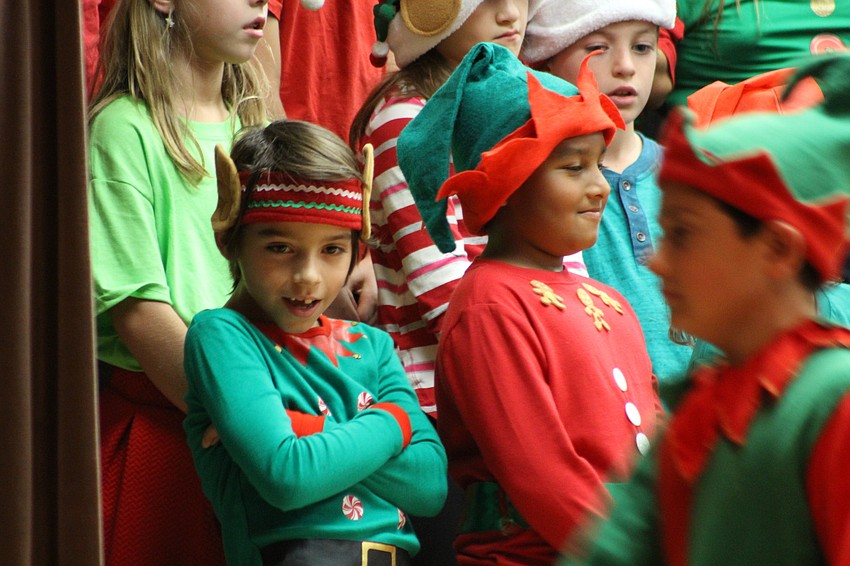 Willis Elementary School third-grader Daxton Martin gets into the song during the holiday show.