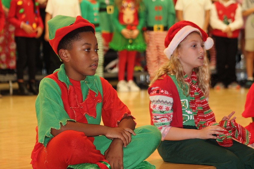 Willis Elementary School third-graders Kingston Mosley and Rachel Gocinski were not just students on this day, they were Santa's elves.