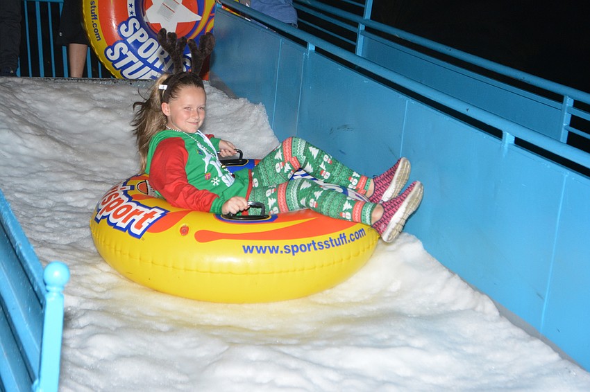East County's Eva Abraham, 9, enjoys the real snow at Holidays Around the Ranch.