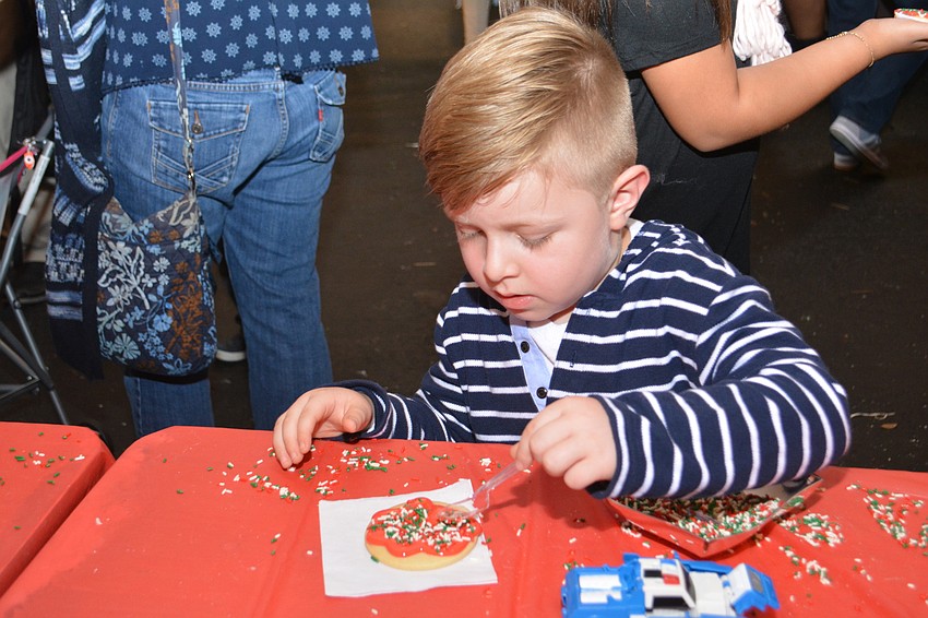 Lakewood Ranch's Rodrigo Marin, 4, is the picture of concentration as he decorates a cookie.