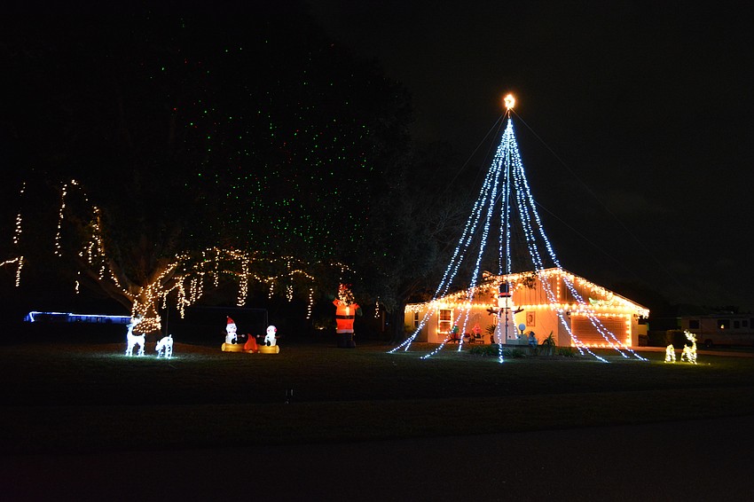 Visitors to 1008 110th Street E., in East County are treated to a light display that is accompanied to softly-playing Christmas music. (Photo by Pam Eubanks).
