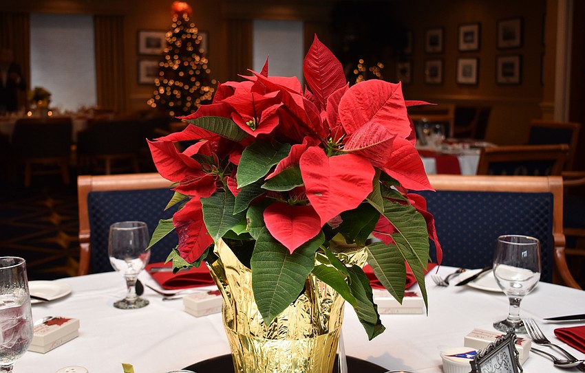 Each table was appropriately adorned with a poinsettia centerpiece.