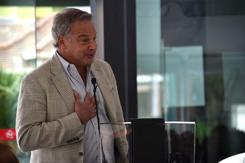 Chairman of the Board of Trustees Dean Eisner addresses the crowd at the ribbon cutting.