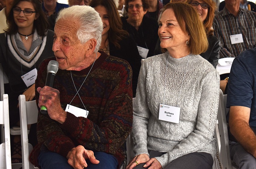 Richard Basch says a few words before he, Barbara Basch and others cut the ribbon on the completed Richard and Barbara Basch Visual Arts Center.