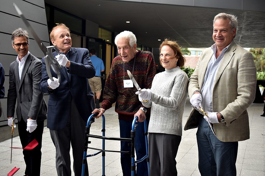 Jerry Sparkman, Ringling College of Art and Design President Larry Thompson, Richard and Barbara Basch and Chairman of the Board of Trustees Dean Eisner are all smiles as they cut the ribbon.