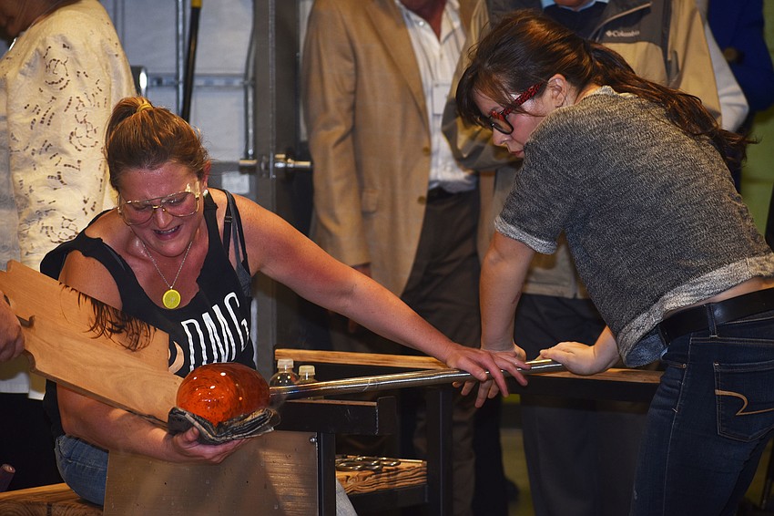 Attendees watched a glass blowing demonstration following the ribbon cutting.