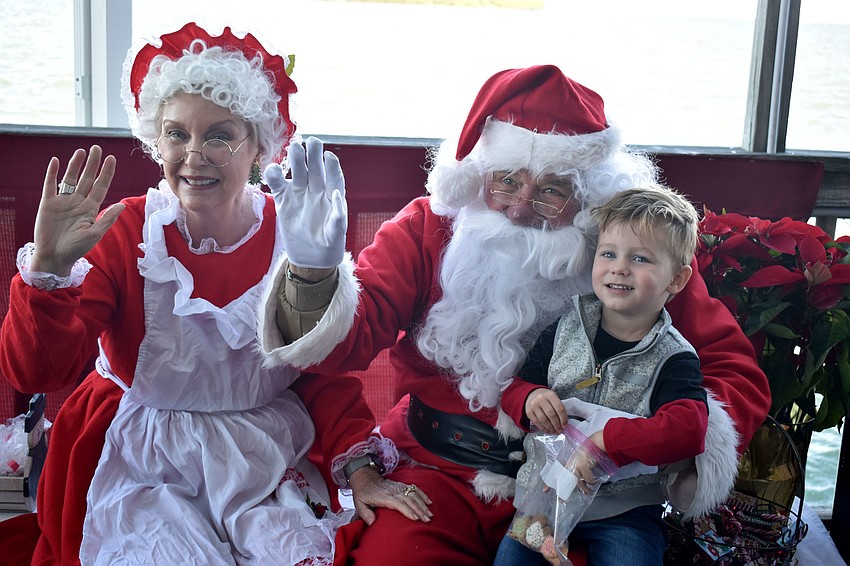 Bennett Rapihana is all smiles during his visit with Santa and Mrs. Claus.