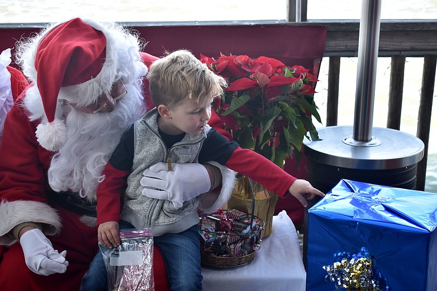Bennett Rapihana tells Santa he wants that blue present for Christmas.