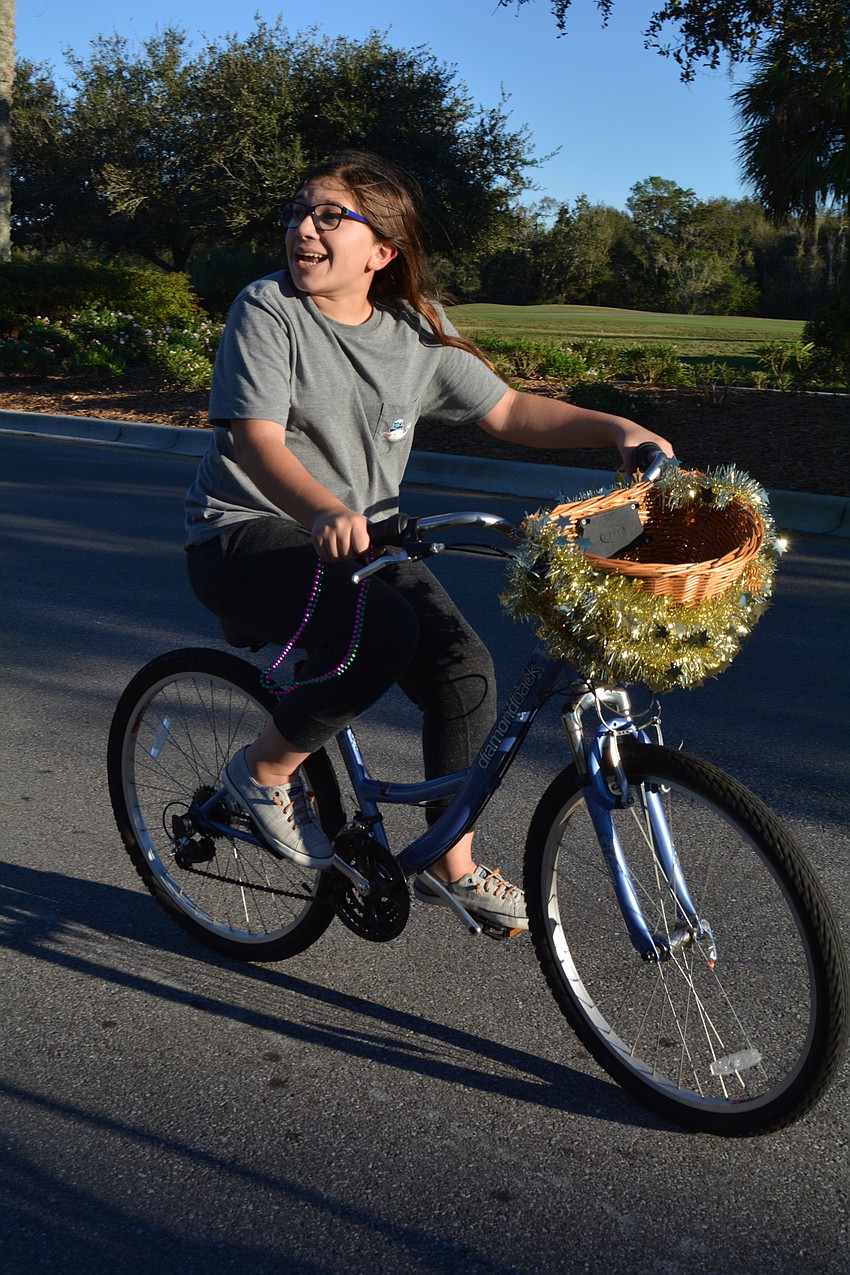 Julia Craig, 13, was one of three bicyclists to participate in the parade.