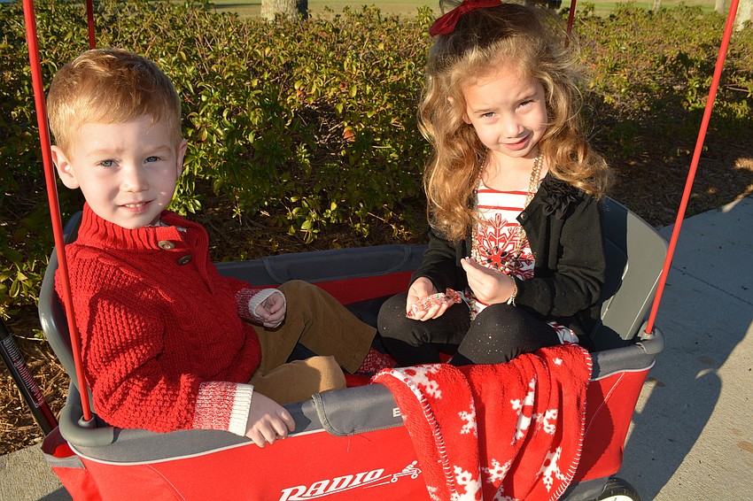 Caleb and Claire Miller watch the parade from the road.