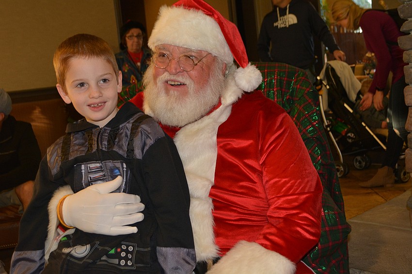 Dillon Swanger, 7, makes sure to visit Santa after the parade.