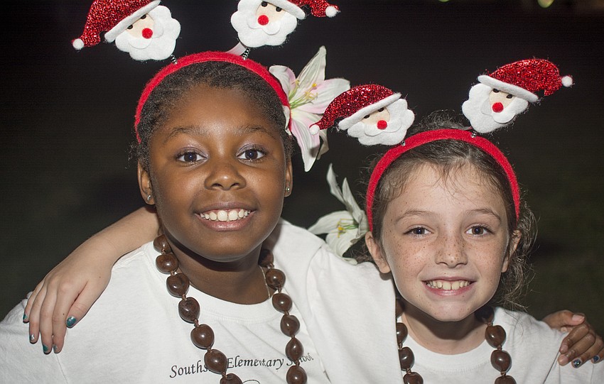 Ava Harlan-Vale and Madison Anderson pose after performing at The Ringling's Holiday Splendor event.
