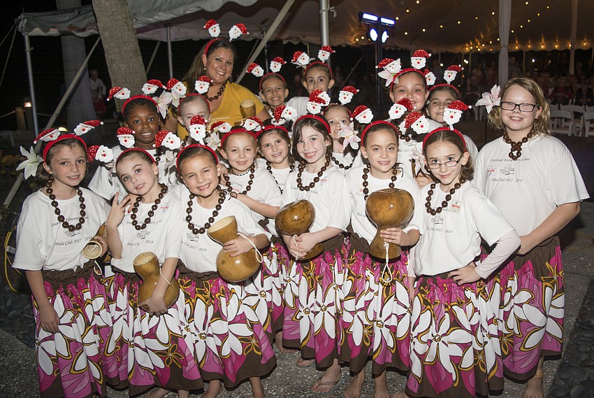 The Southside Side Hula dancing club poses after performing at The Ringling's Holiday Splendor event.
