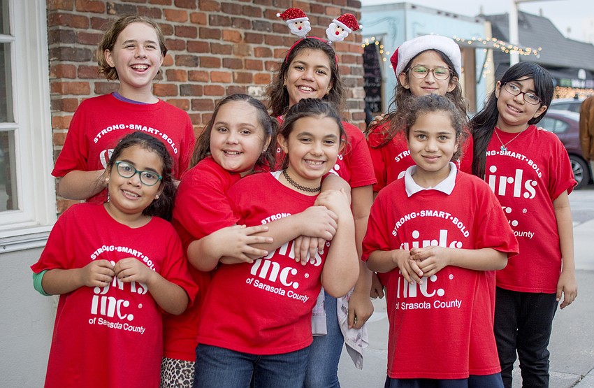 Girls Inc. members sang Christmas carols for eventgoers.