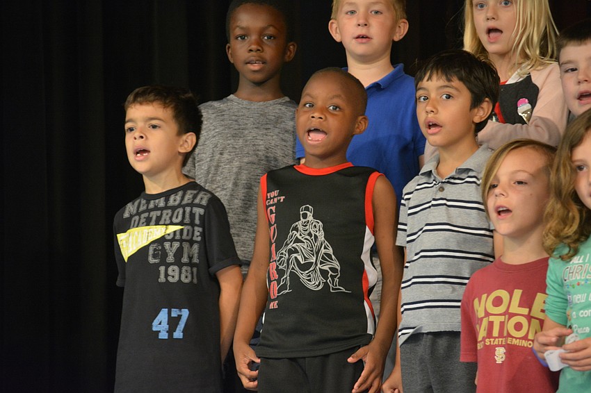 Adrian Leon-Rodriguez, Javier White Edmundo Ramos and Troy Hess, front row, sing with gusto.