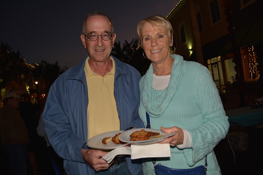 Larry and Jan Levin, of River Club eat latkes. 