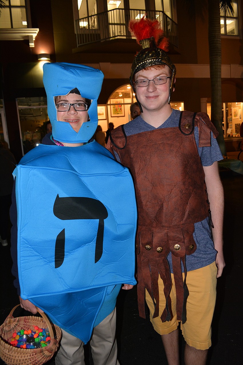 Parrish's Zachary Korman, 14, and Daniel Braunstein, a student at Braden River High, dress as a dreidel and Judah the Maccabee and are ready to pose for pictures with attendees.