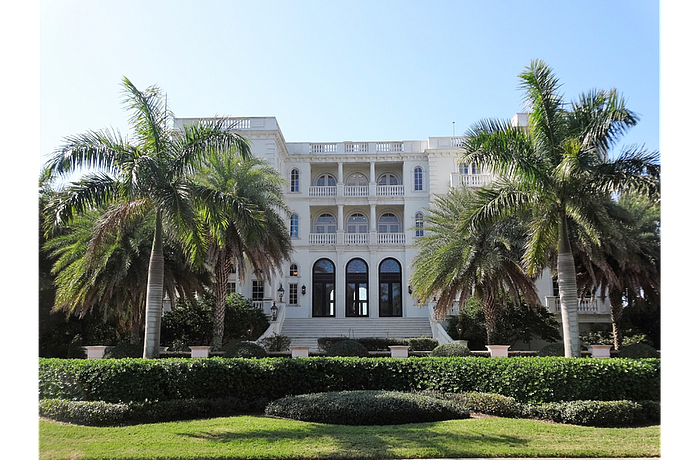 The Venetian-inspired estate features a three-story main house.