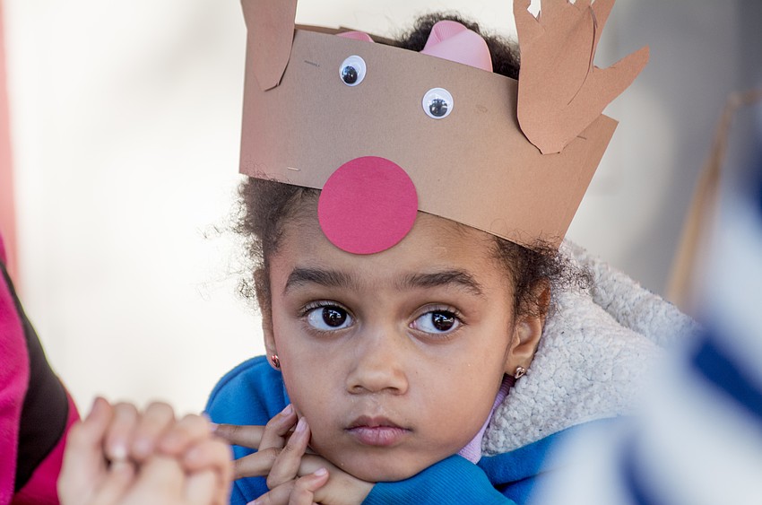 Za'myiah listens to her teacher read.
