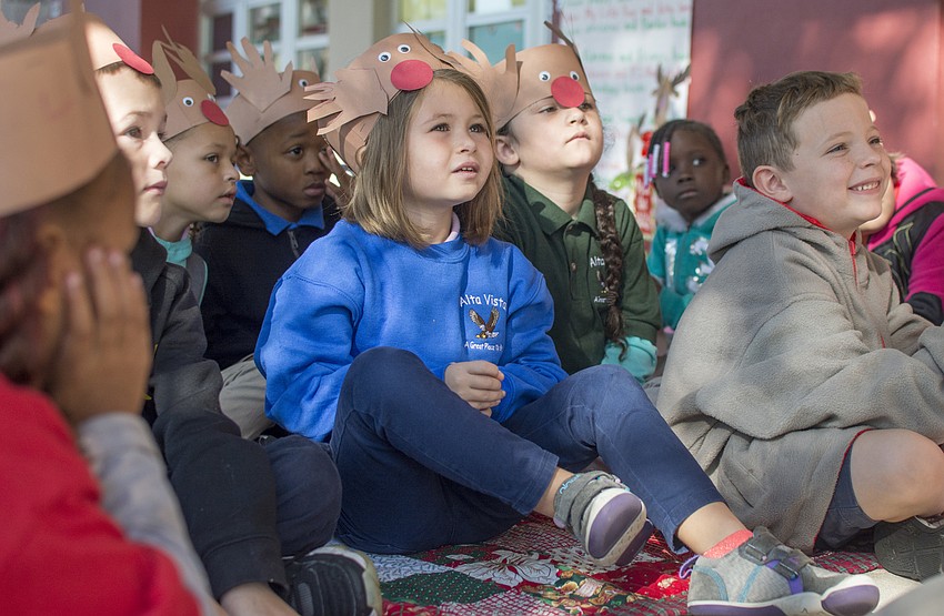 Alta Vista kindergartners listen to their teacher Teresa Carrier (not pictured) reading aloud.