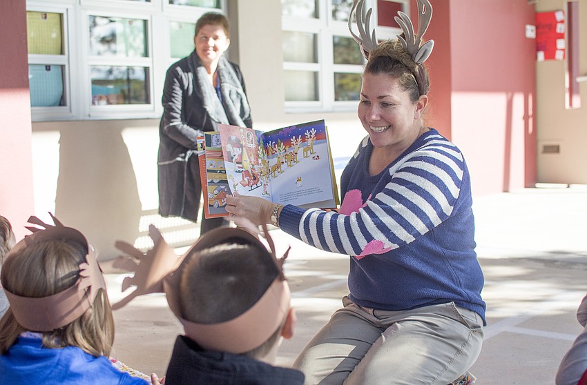 Kindergarten teacher Teresa Carrier reads during Alta Vista's Reading Street event.