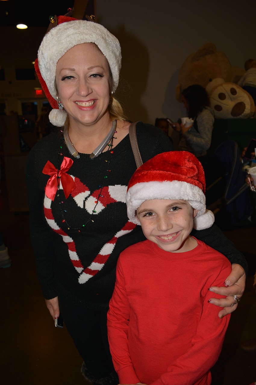 Jennifer and Michael Martin, of Parrish, wait to meet Santa.