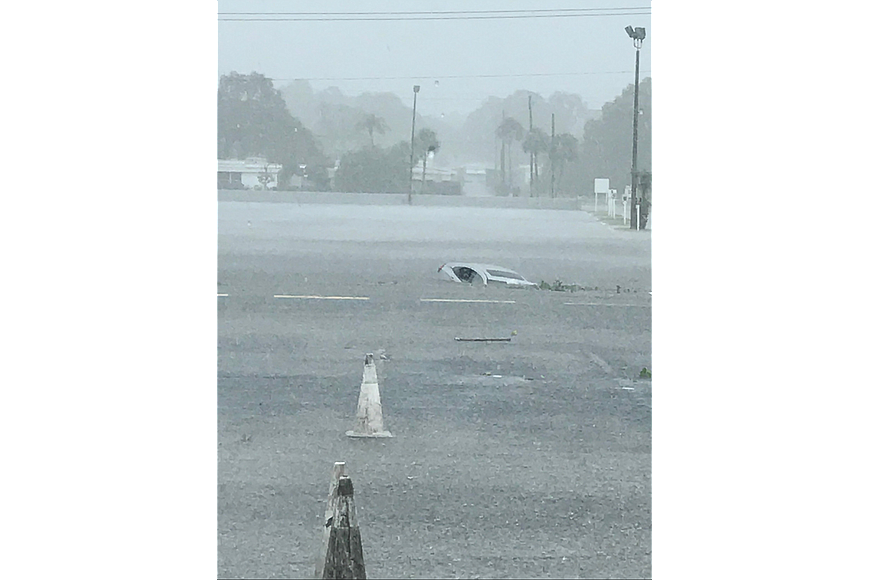 A man driving over a flooded roadway drove his car into a drainage ditch, according to officials with the Sarasota Police Department. Officers were able to pull him from the water, but he later died on his way to the hospital.