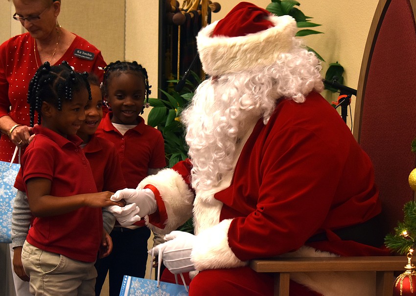Journey Ingram and fellow classmates talk with Santa Claus.