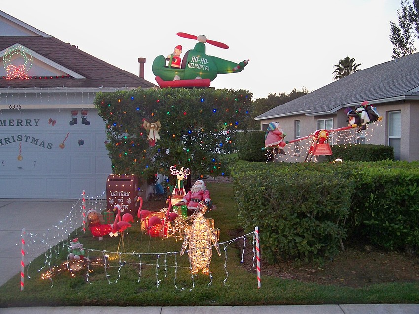 Among the favorite displays for Ray Papiano, owner of 6326 Yellowtop Dr. in Lakewood Ranch, is Santa's sleigh led by pink flamingos. (Courtesy photo.)