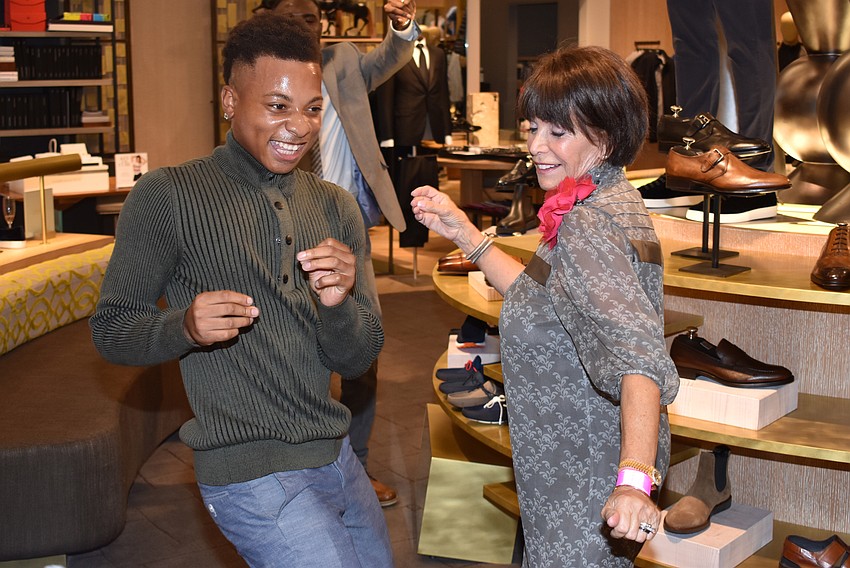 Will Mauricette and Shony Silva bust some moves in the shoe section at Key to the Cure on Oct. 12.