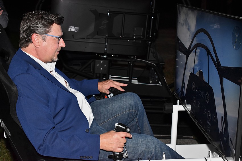 William Muck tries his hand at the flight simulator.