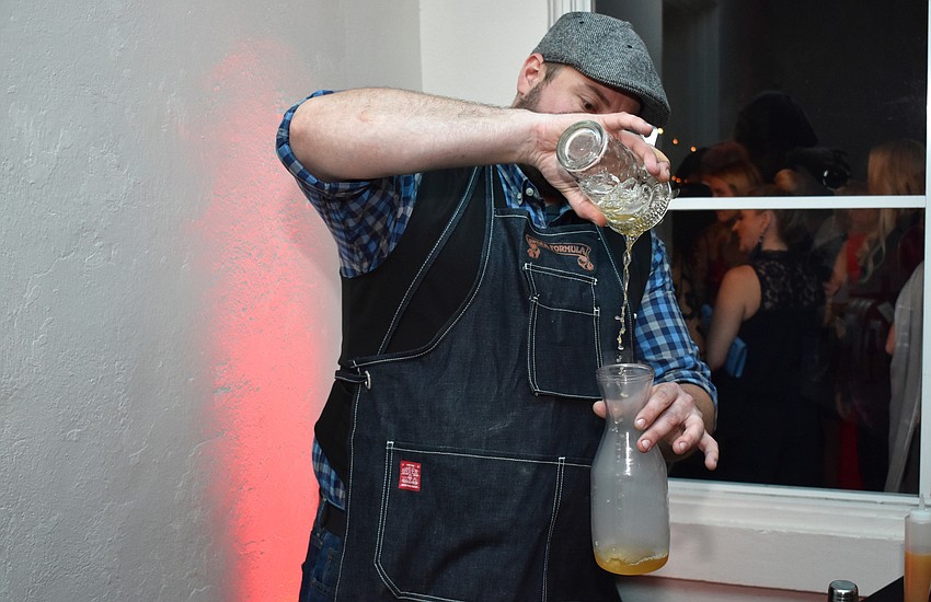 Michael Scalzi of Cask & Ale makes a whiskey cocktail.