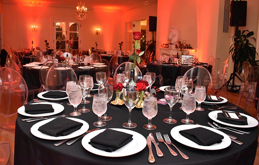 Select guests enjoyed dinner in a romantically lit dining room of Edson Keith Mansion.